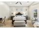 Bright bedroom with a statement headboard and bench at the foot of the king bed at 2625 N 24Th St # 36, Mesa, AZ 85213