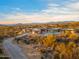 Breathtaking aerial view of a desert home surrounded by natural beauty, showcasing the pool and mountain views at 28110 N 96Th Pl, Scottsdale, AZ 85262