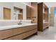 Well-lit bathroom boasting dual vanities with modern fixtures, offering a seamless blend of style and functionality at 28110 N 96Th Pl, Scottsdale, AZ 85262