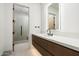 Modern bathroom with single vanity and walk-in shower at 28110 N 96Th Pl, Scottsdale, AZ 85262