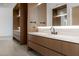 Stylish bathroom featuring dual vanities with modern fixtures and ample storage, creating a functional and elegant space at 28110 N 96Th Pl, Scottsdale, AZ 85262