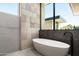 Luxurious bathroom with freestanding tub and mountain views at 28110 N 96Th Pl, Scottsdale, AZ 85262