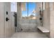 Modern shower room with stylish fixtures, tiled walls, and a window with a view, offering a spa-like experience at 28110 N 96Th Pl, Scottsdale, AZ 85262