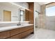 Modern bathroom with walk-in shower and marble tile at 28110 N 96Th Pl, Scottsdale, AZ 85262