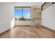 Bright bedroom with hardwood floors, large windows with mountain views, and white walls at 28110 N 96Th Pl, Scottsdale, AZ 85262