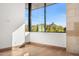 Bright bedroom with hardwood floors, a large window with mountain views, and white walls at 28110 N 96Th Pl, Scottsdale, AZ 85262