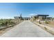 Modern home with long driveway and desert landscaping at 28110 N 96Th Pl, Scottsdale, AZ 85262