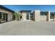 Contemporary home entry with stone and glass at 28110 N 96Th Pl, Scottsdale, AZ 85262