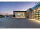 Modern garage with glass doors, showcasing luxury cars at 28110 N 96Th Pl, Scottsdale, AZ 85262