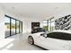 Bright garage with large windows, showcasing two luxury cars at 28110 N 96Th Pl, Scottsdale, AZ 85262