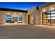 Stunning modern home garage showcasing two luxury vehicles behind glass doors with a beautiful driveway at 28110 N 96Th Pl, Scottsdale, AZ 85262