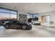 Luxury garage with two sports cars and sunset view at 28110 N 96Th Pl, Scottsdale, AZ 85262