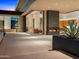 Luxury home patio with fireplace, outdoor seating and desert landscaping at 28110 N 96Th Pl, Scottsdale, AZ 85262