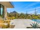 Open patio with desert landscaping, modern design and mountain views at 28110 N 96Th Pl, Scottsdale, AZ 85262