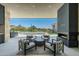 Outdoor seating area with fireplace and view of pool and mountains at 28110 N 96Th Pl, Scottsdale, AZ 85262