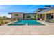 Modern home with a stunning pool, outdoor living space, and desert landscaping at 28110 N 96Th Pl, Scottsdale, AZ 85262