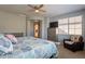 Main bedroom with ceiling fan, large windows and dresser at 28731 N 20Th Ln, Phoenix, AZ 85085