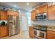 Kitchen features stainless steel appliances and ample wood cabinetry at 28731 N 20Th Ln, Phoenix, AZ 85085