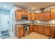 Well-equipped kitchen with wood cabinets and granite countertops at 28731 N 20Th Ln, Phoenix, AZ 85085