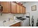 Laundry room with washer, dryer, and cabinets at 28731 N 20Th Ln, Phoenix, AZ 85085