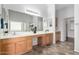 Bathroom featuring double sink vanity, tile floors and large mirror at 29050 N Mountain View Rd, San Tan Valley, AZ 85143