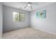 Cozy bedroom with carpet, ceiling fan, and a bright window at 29050 N Mountain View Rd, San Tan Valley, AZ 85143