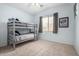 Bedroom with a gray bunkbed and a large window at 29050 N Mountain View Rd, San Tan Valley, AZ 85143