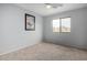 Light-filled bedroom with carpet, ceiling fan, and natural light from the window at 29050 N Mountain View Rd, San Tan Valley, AZ 85143