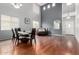 Bright dining room with high ceilings, hardwood floors, and modern chandelier at 29050 N Mountain View Rd, San Tan Valley, AZ 85143