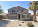 Charming two-story home with a well-manicured desert landscape and a convenient two-car garage at 29050 N Mountain View Rd, San Tan Valley, AZ 85143