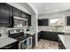 Kitchen featuring stainless steel appliances, granite countertops and tile backsplash at 29050 N Mountain View Rd, San Tan Valley, AZ 85143