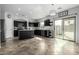 Modern kitchen with stainless steel appliances, center island, and sliding glass door at 29050 N Mountain View Rd, San Tan Valley, AZ 85143