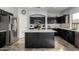 Well-equipped kitchen featuring stainless steel refrigerator and a stylish center island at 29050 N Mountain View Rd, San Tan Valley, AZ 85143