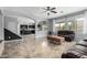 Open-concept living room featuring a view into the kitchen with black cabinets at 29050 N Mountain View Rd, San Tan Valley, AZ 85143