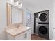 Bright bathroom with vanity, mirror, and stacked washer/dryer at 2917 N 8Th Ave, Phoenix, AZ 85013