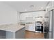 Modern kitchen with white shaker cabinets and granite countertops at 2917 N 8Th Ave, Phoenix, AZ 85013