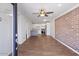 Open living area with exposed brick wall and a view into the kitchen at 2917 N 8Th Ave, Phoenix, AZ 85013