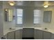 Bright bathroom featuring double vanity sinks, mirrors, and neutral decor at 29967 N Sandridge Dr, Queen Creek, AZ 85144