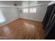 This bedroom features wood-look floors, natural light, and white walls at 29967 N Sandridge Dr, Queen Creek, AZ 85144