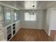 Bright dining room with hardwood floors, built-in cabinets, and a chandelier at 29967 N Sandridge Dr, Queen Creek, AZ 85144