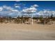 Street view of desert property with arid landscape and a home in the background at 29967 N Sandridge Dr, Queen Creek, AZ 85144