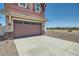 Two-car garage with stone accents and driveway at 3346 S 82Nd St, Mesa, AZ 85212