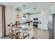 Modern kitchen with white cabinets, island, and pendant lighting at 3346 S 82Nd St, Mesa, AZ 85212