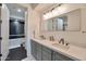 Modern bathroom with double vanity, white quartz countertops, and a soaking tub at 34457 N Legend Trail Pkwy # 1018, Scottsdale, AZ 85262