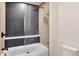 Clean bathroom with a shower/tub combo and dark tile at 34457 N Legend Trail Pkwy # 1018, Scottsdale, AZ 85262