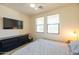 Bedroom with large bed, dresser, TV and natural light at 34457 N Legend Trail Pkwy # 1018, Scottsdale, AZ 85262