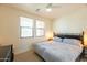 Bright bedroom with a large bed, window blinds, and ceiling fan at 34457 N Legend Trail Pkwy # 1018, Scottsdale, AZ 85262