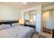 Spacious bedroom with mirrored closet doors and large bed at 34457 N Legend Trail Pkwy # 1018, Scottsdale, AZ 85262