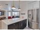 Stylish kitchen with white and dark cabinetry, breakfast bar at 34457 N Legend Trail Pkwy # 1018, Scottsdale, AZ 85262