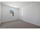 Bright bedroom featuring neutral walls and carpet at 34690 N Ashwood Dr, San Tan Valley, AZ 85144